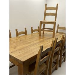 Large pine dining table, rectangular top on turned supports (212cm x 111cm, H80cm), and set nine (7+2) farmhouse style dining chairs with ladder backs and rush seats 