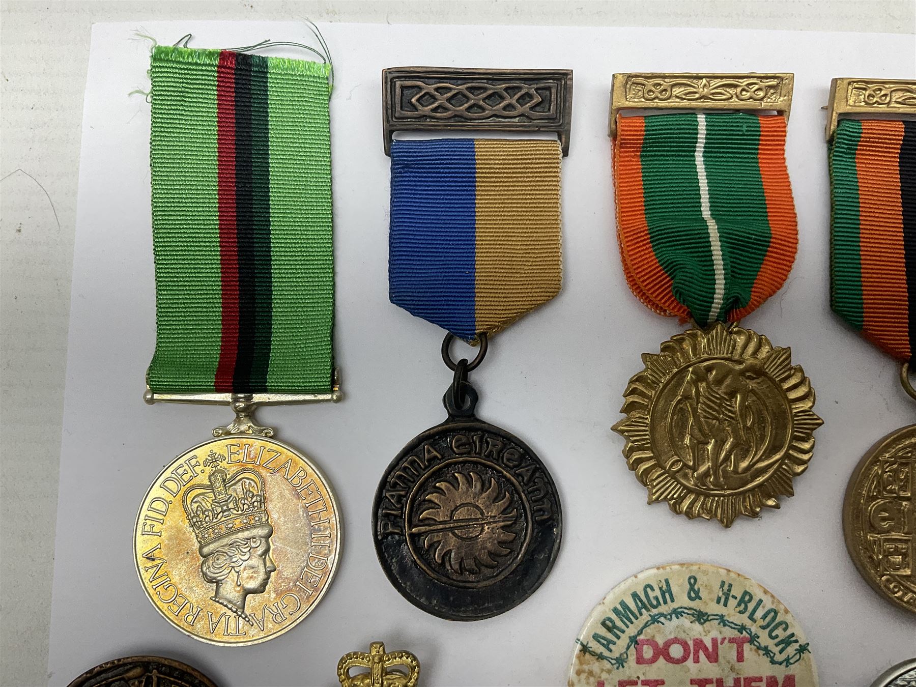 Small collection of Irish related medals, cap badges, buttons, political pin badges etc