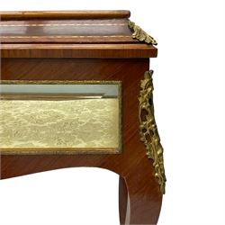 Mid-to-late 20th century French design Kingwood and walnut bijouterie cabinet, enclosed by cavetto moulded hinged lid with gilt metal foliage cast mounts and checkered stringing, on cabriole supports mounted by ornate cartouche castings and scrolled foliate terminal caps, lined in gold foliate pattern fabric and glazed with bevelled glass