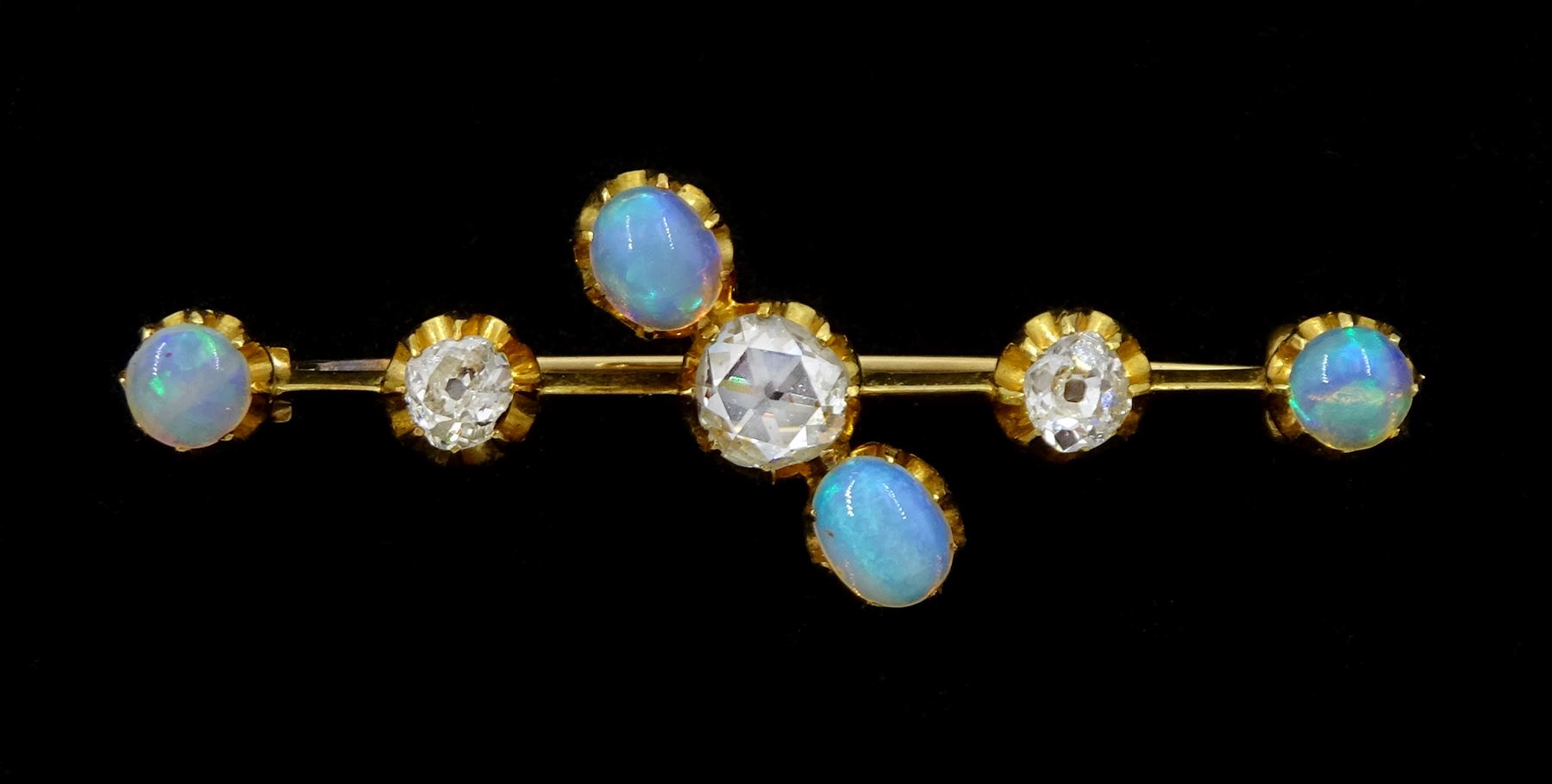 Early 20th century 15ct gold opal and diamond brooch, the central rose cut diamond, with old cut diamonds set either side, total diamond weight approx 0.60 carat