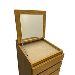 IKEA light oak finish chest, fitted with hinged vanity top, above six graduating drawers 