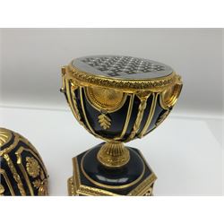 Franklin Mint House of Faberge; The Imperial Jeweled Egg Chess set, the egg opening to reveal a chess board, with a draw to the hexagonal base holding the miniature chess pieces, H23cm 