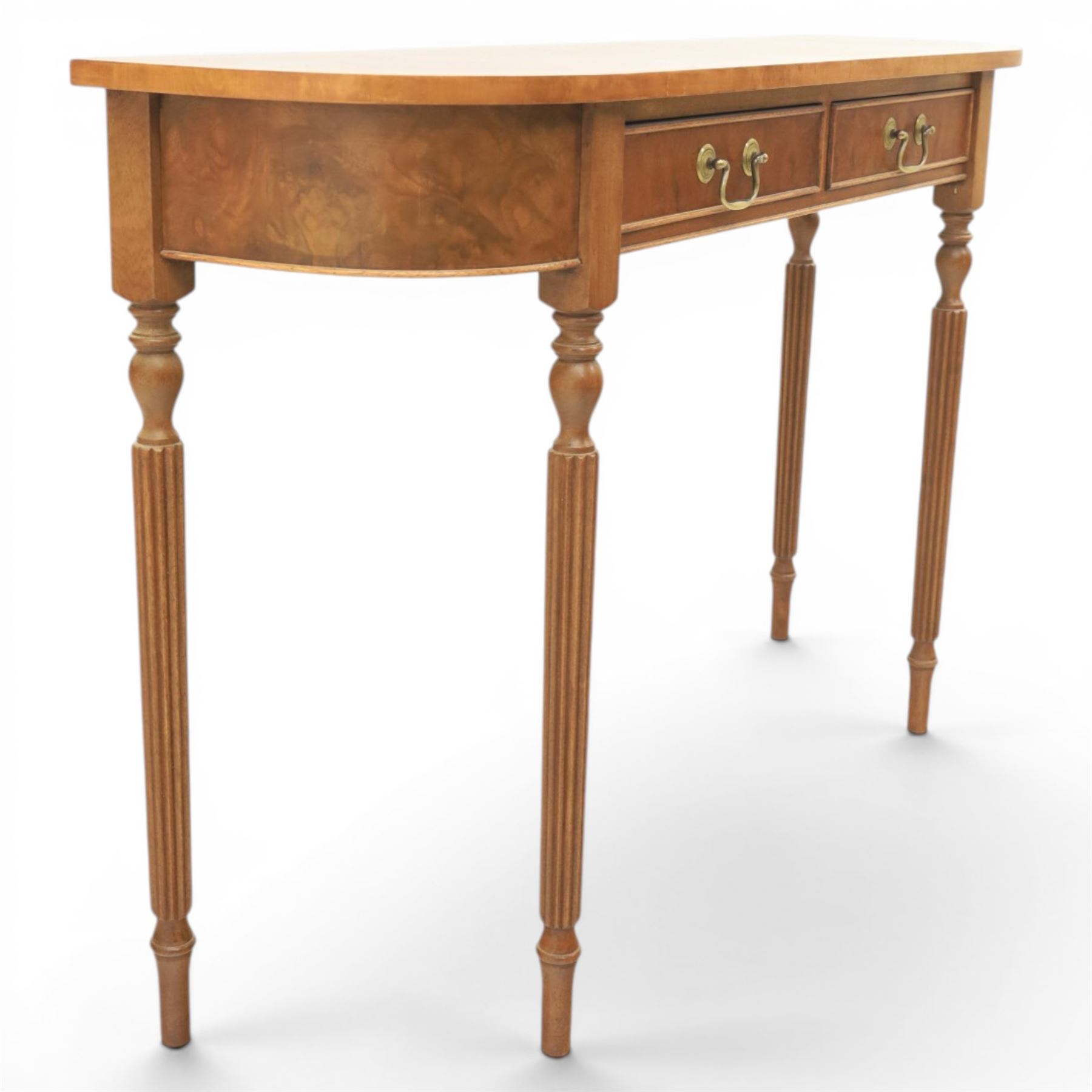 Traditional design walnut D-end hall table, figured top and sides, two frieze drawers with brass handles raised on fluted and turned supports