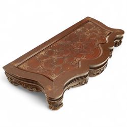 Chinese stained hardwood side table, late Qing dynasty style, with shaped top above a pierced and carved frieze of foliage and fruiting vines, cabriole legs terminating in scroll feet, united by a carved shaped undertier