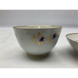 Two 18th century Newhall tea bowls and saucers, the first example decorated with pattern no 195, hand painted painted with floral sprays, the second hand painted with flowers in a gilt boarder, together with a similar tea bowl