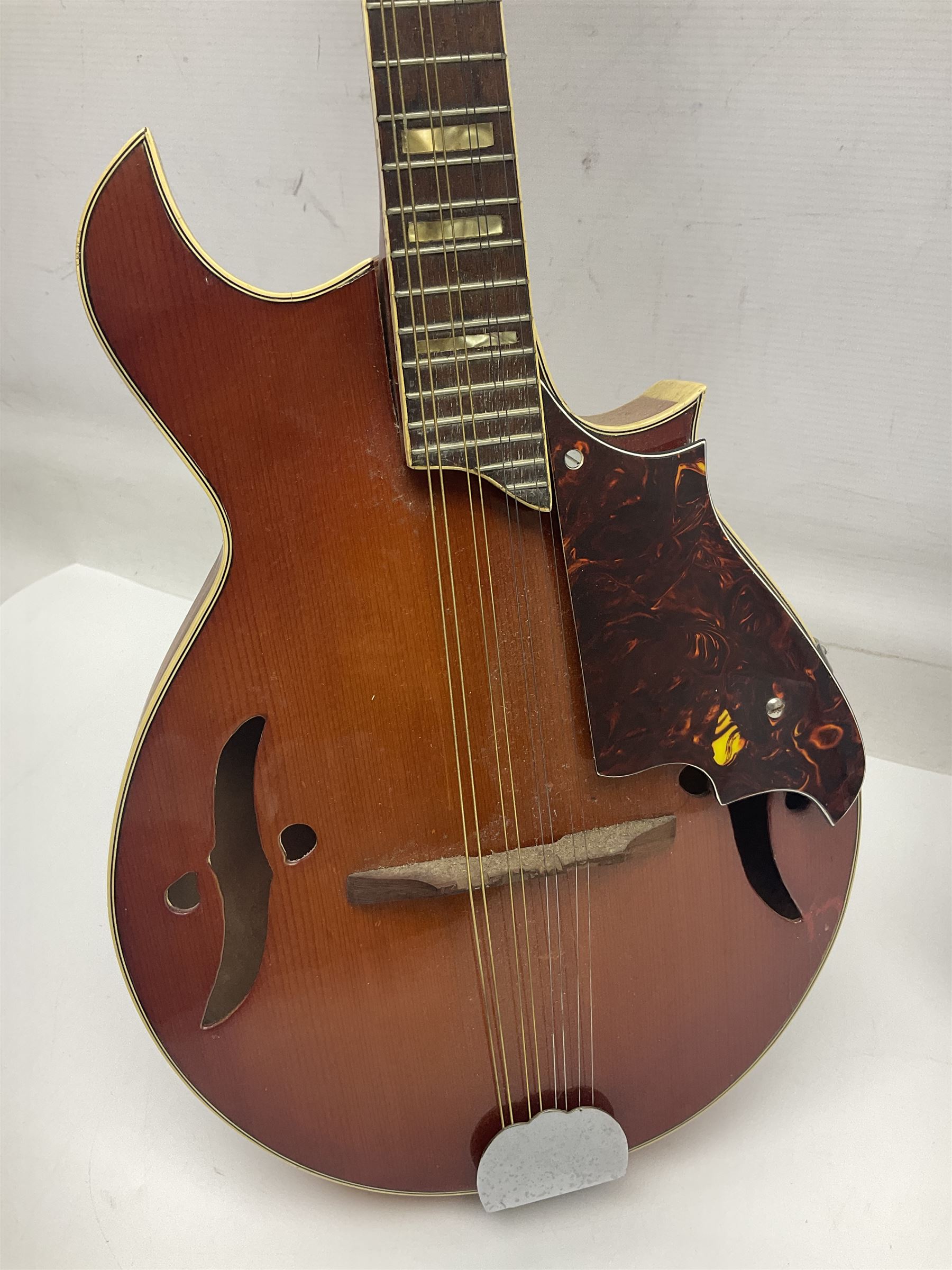 Eastern eight-string mandolin with sunburst finish and mother-of-pearl inlay L68.5cm; and another Harmony mandolin with cracked headstock (2)