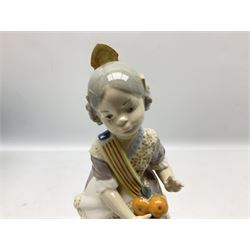 Lladro figure, Miss Valencia, modelled in traditional Valencian dress with basket of oranges, sculpted by Juan Huerta, with original box, no 1422, year issued 1982, year retired 1997, H18cm