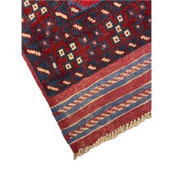 Meshwani red and blue ground runner, decorated with repeating lozenge medallions, overall geometric design
