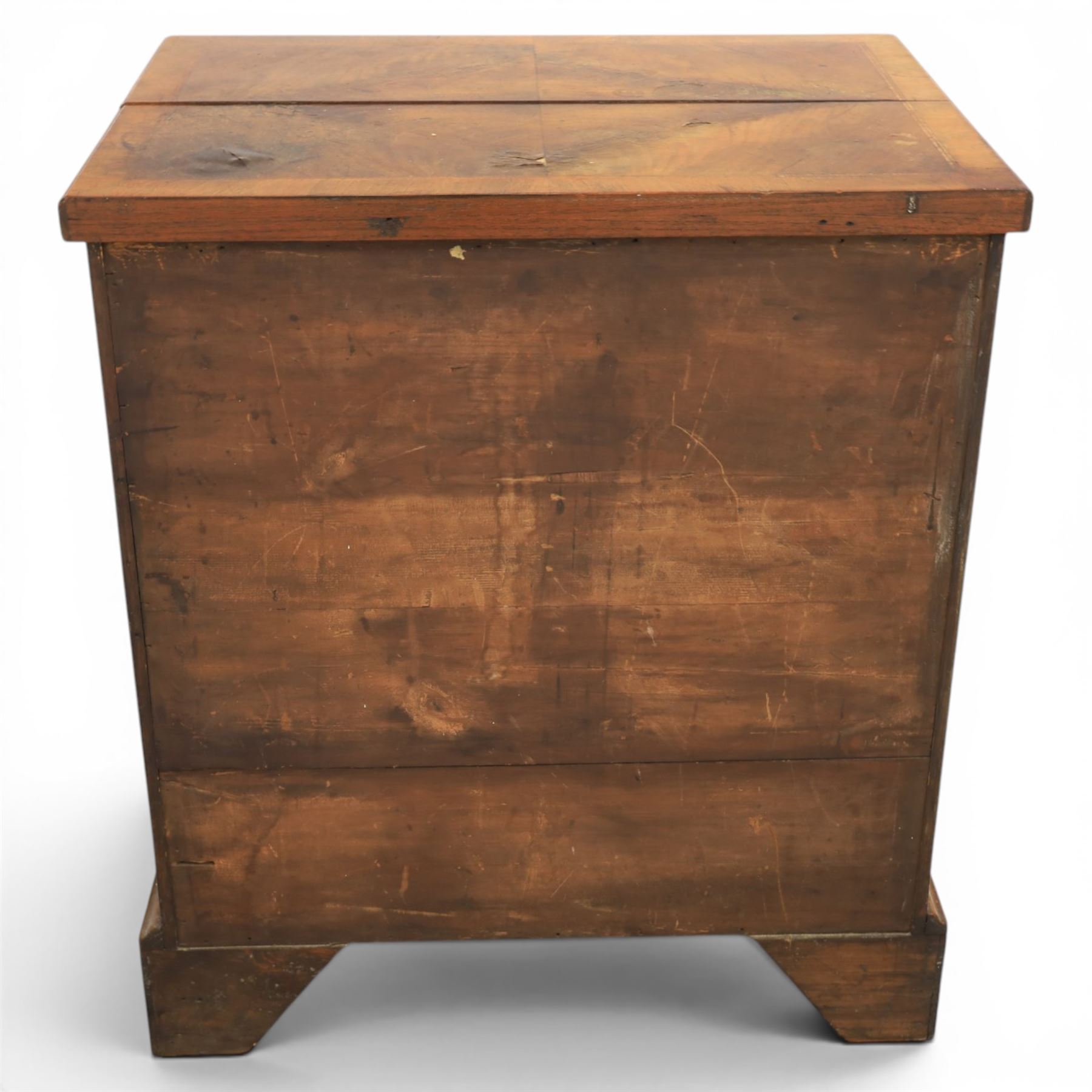 Early 20th century Georgian design figured walnut bachelor's chest, with half fold over top and lopers, over three drawers with pierced brass handles and escutcheons 