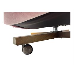 Paul Conti for G-Plan - 'Blofeld' Model 6250 swivel wingback armchair, upholstered in pink velour button back fabric, on teak base with castors