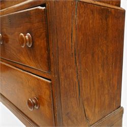 18th century oak larder cupboard, projecting moulded cornice over two panelled doors with shaped arched fielded panels, three short dummy drawers above base fitted with two short and one long drawer, turned handles, on bracket feet