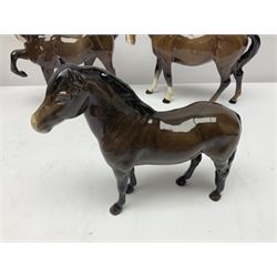 Four Beswick horses, including Exmoor no 1645, Black Beauty foal and two others 