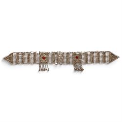 Collection of Middle Eastern jewellery, including silver necklace with a crescent  shaped pendent with beadwork and barrel tasselled ends, nickel silver wedding necklace with filigree decoration, coin bracelet, two bridal wedding caps and two others 