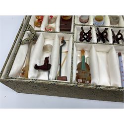 Chinese boxed collection of miniature polished hardstone musical instruments with hardwood stands
