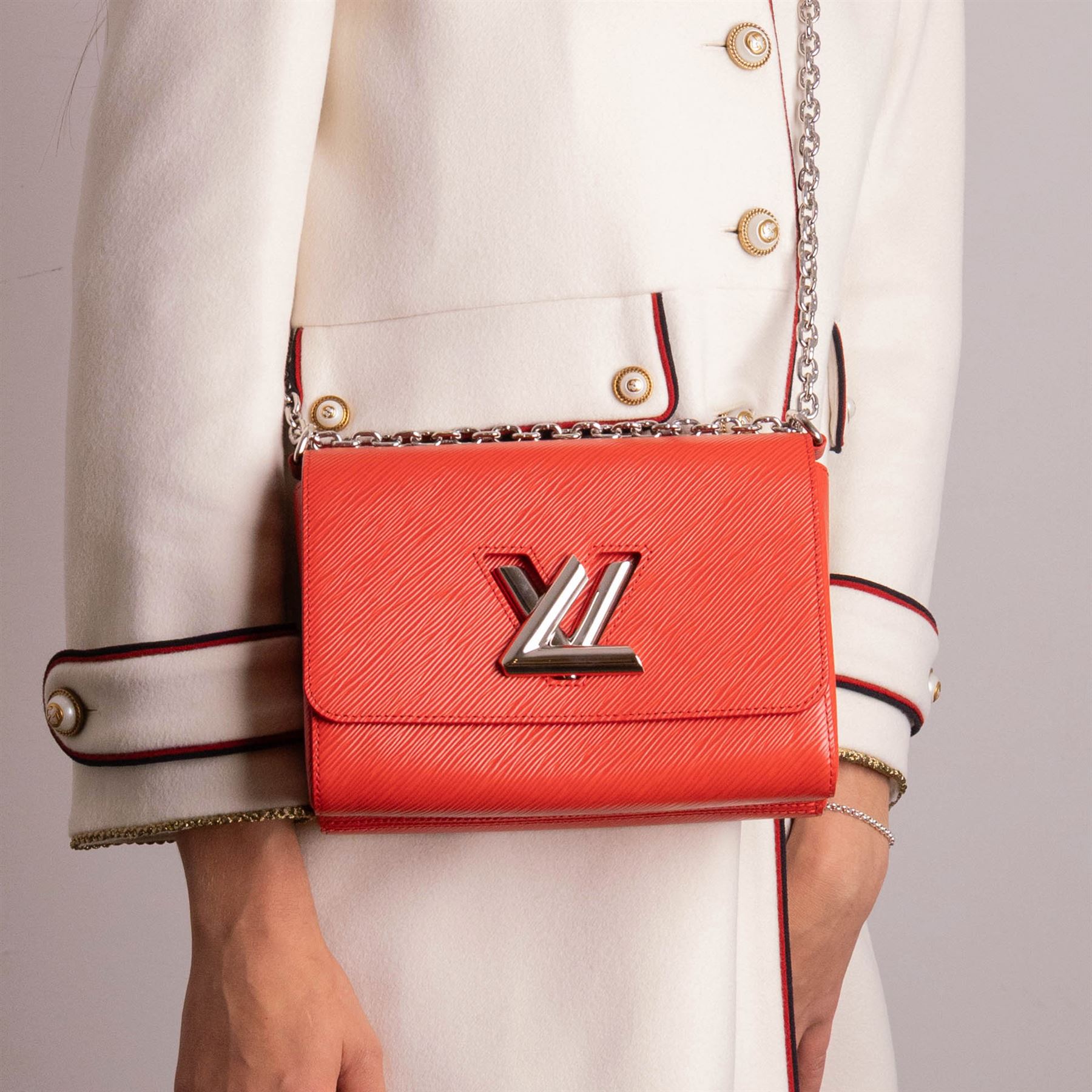 Louis Vuitton - ‘Twist’ MM Bag, the model introduced for the Cruise 2015 collection under Nicolas Ghesquière, in structured Coquelicot red Epi leather, with silver-tone LV twist-lock fastening and chain and carrying handle, with detachable flat leather shoulder or crossbody strap, unused with original box and dust bag
