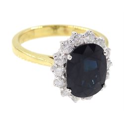 18ct gold oval sapphire and round brilliant cut diamond cluster ring, hallmarked, sapphire approx 3.30 carat, total diamond weight approx 0.70 carat