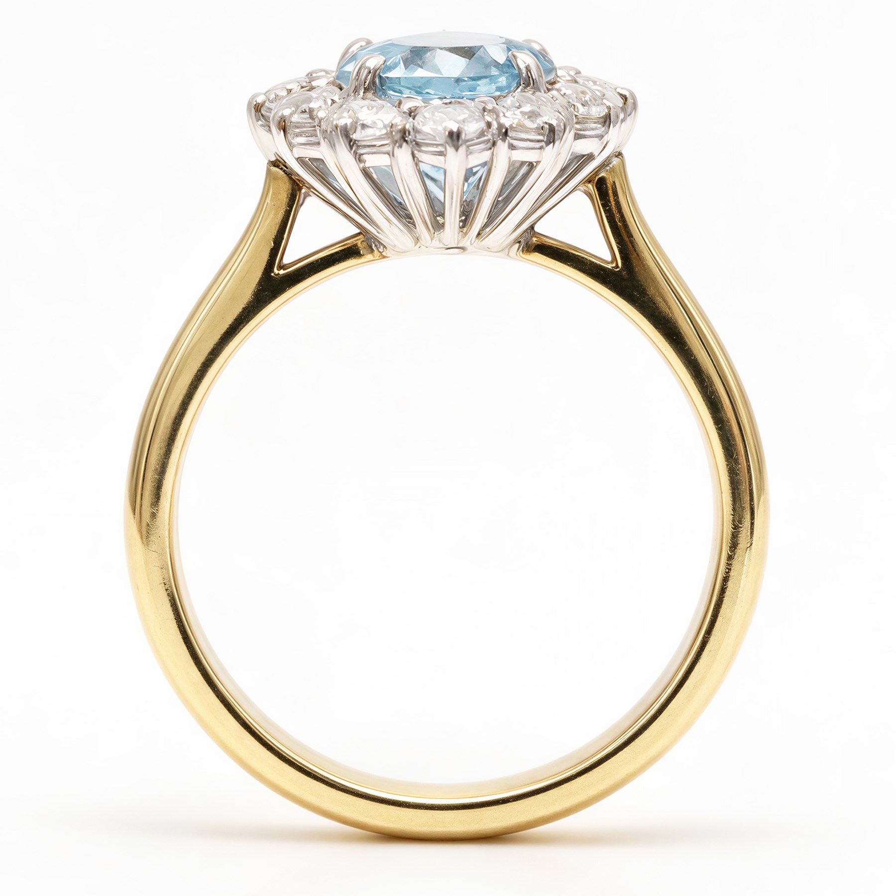 18ct gold aquamarine and diamond cluster ring, single oval cut aquamarine of approx 1.25 carat, surrounded by twelve round brilliant cut diamonds, hallmarked, total diamond weight approx 0.30 carat
