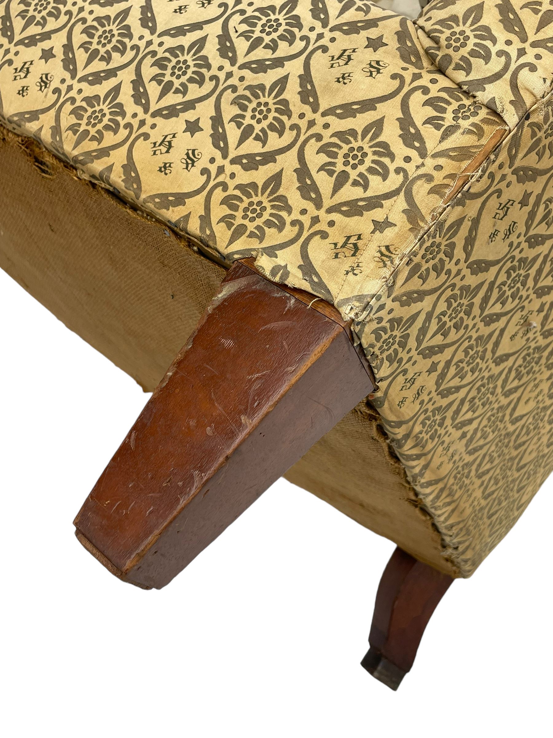 Howard & Sons - Edwardian mahogany framed two seat sofa, upholstered in original H&S foliate patterned fabric with sprung seat and overstuffed back and arms, raised on square tapering supports, the rear leg stamped '19600 1795 Howard & Sons Ltd Berners Street'