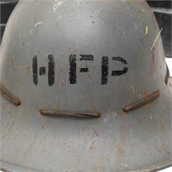 British military leather cordite shot carrier with coat of arms H52cm, Zuckerman Civil Defence helmet with liner and inscribed H.F.P. (Head of Fire Party),  and two gas masks