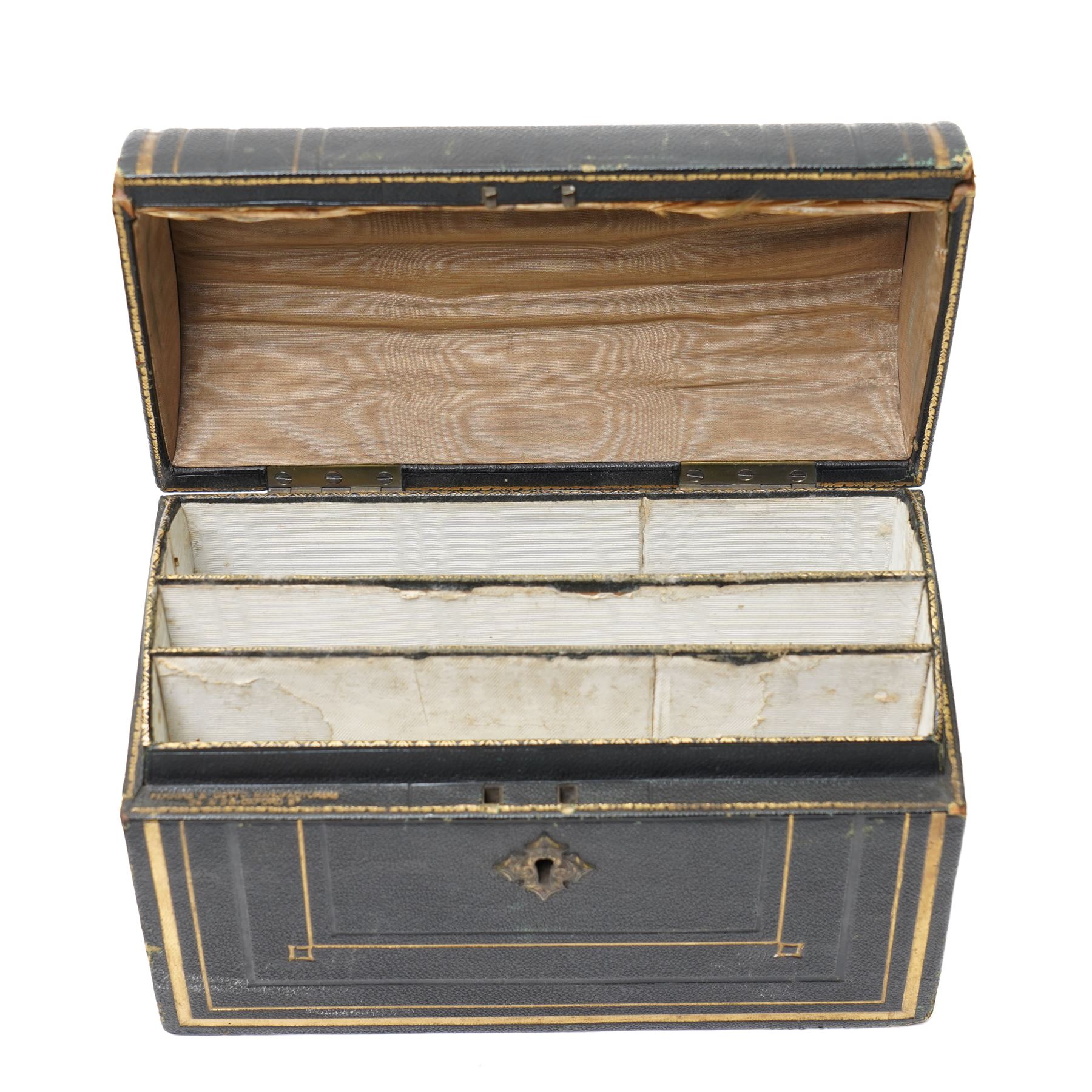 Victorian tooled leather dome top stationery casket by Parkins & Gotto, 24 & 25 Oxford St  with watered silk interior L21cm , another dome top casket and a lancet top casket (3) 
Provenance: property of a Nobleman