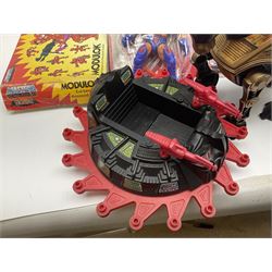 Thirty-one Masters of the Universe He-Man figures re-bagged on original backing cards;  two others lacking backing cards; boxed Modulok figure; bag of weapons and accessories; Roton, two horses and two battle cats; 1986 & 1987 Annuals; Ladybird and other story books; Panini sticker album; instructions etc