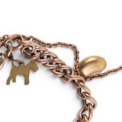 9ct gold curb link bracelet with heart padlock clasp, hallmarked, with gold imp and orb charm and two gilt charms