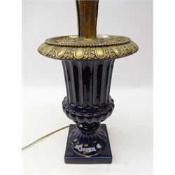  Porcelain and brass table/ floor lamp modelled as an urn shaped vase of flowers & wheat, with single column light fitting and glass shade, H101cm   