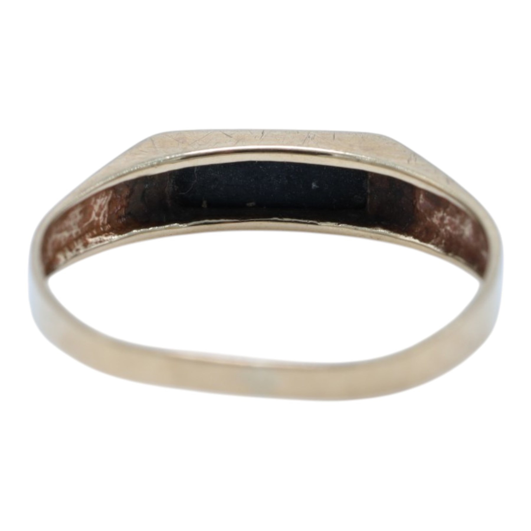 Two 9ct gold stone set rings, comprising paste set eternity ring and an onyx ring, both hallmarked