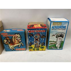Mid 20th century and later tin plate clockwork toys, to include merry-go-rounds, spaceship carousel, walking robot, Schylling airport control tower, monkey riding horse, astronaut space station etc, including German and Japanese examples, some with boxes (12)