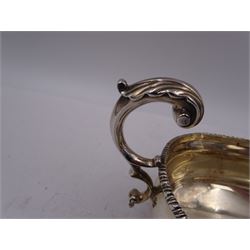Victorian silver sauce boat, of typical form with oblique gadrooned rim and acanthus capped flying C scroll handle, upon three shell pad feet, hallmarked Charles Stuart Harris, London 1898, including handle H10cm