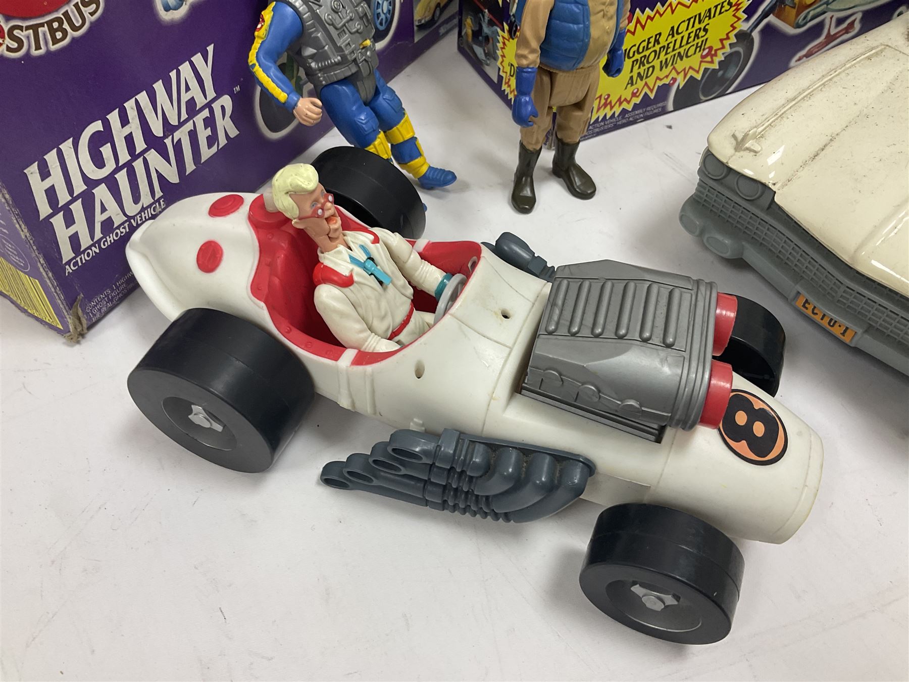 Ghostbusters - 'ECTO 1' car with two figures; ECTO-2 Vehicle, Highway Hunter Action Ghost Vehicle and Haunted Vehicles Air Sickness; all boxed; racing car with Egon Spengler driver; two 1984 Marshmallow Man figures; and four unopened carded/boxed figures etc