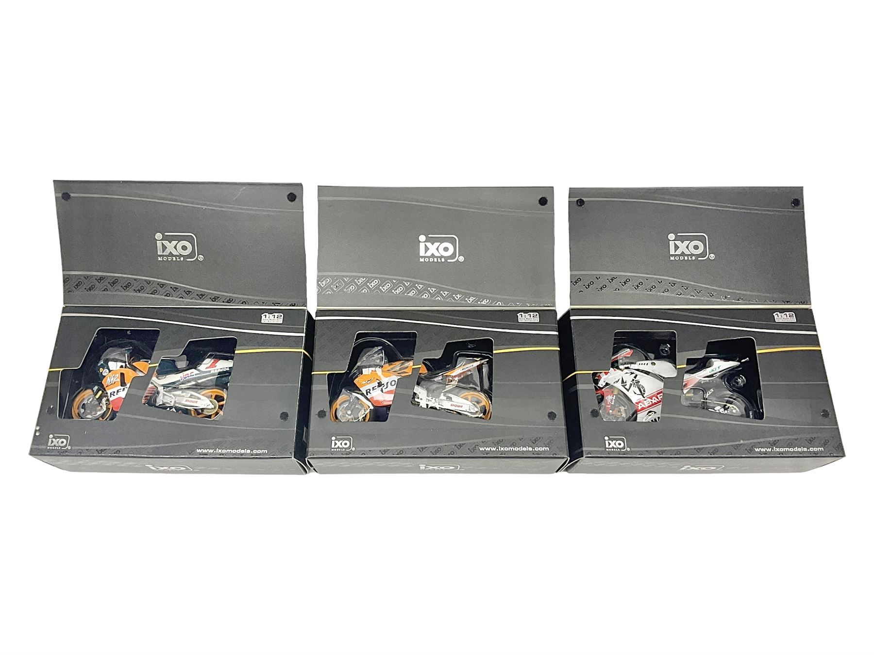 Three Ixo Models 1:12 scale die-cast models of motorcycles - BRB007 Honda NSR500 Michael Doohan 1998; BRB001 Honda RC211V Valentino Rossi 2003; and Yamaha YZR-M1 Colin Edwards MotoGP Phillip Island 2007; all boxed (3)