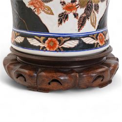 Large Chinese baluster form table lamp, modelled as a vase and cover and painted with bamboo, flowers and rockwork, on hardwood base with shade H54cm, excluding fitting