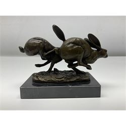 Bronze figure group, modelled as two hares in chase, upon a naturalistic base signed Nick and with foundry mark, raised upon a rectangular marble base, overall H12cm. 