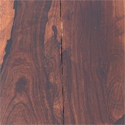 William IV rosewood card table, rounded rectangular swivel and fold-over top with plain frieze, with carved scrolled brackets above stop-fluted column with moulded collar on quadriform base with scrolled feet 