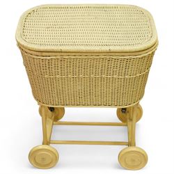 *Mid 20th century nursery set, comprising a cream painted metal cot with adjustable base, a wicker baby basket on wheeled stand, and a folding nursery screen with printed fabric panels decorated with playful animal and teddy bear motifs

Cot (H 112cm, W 136cm, D 77cm)
Screen (H 139cm, W 148cm) 
Basket (H 72cm, W 59cm, D 40cm)From the Kirkham Hall Attic & Cellar Collection, sold without reserve