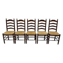 Set of ten 18th century design oak ladder back dining chairs, shaped cresting rail over four horizontal splats, rush seat raised on turned supports united by double stretchers