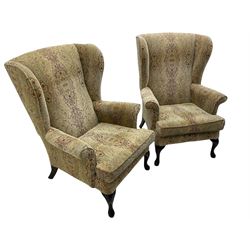 Parker Knoll - 'Burghley' pair of wingback armchairs, upholstered in 'Baslow Medallion' gold floral pattern fabric