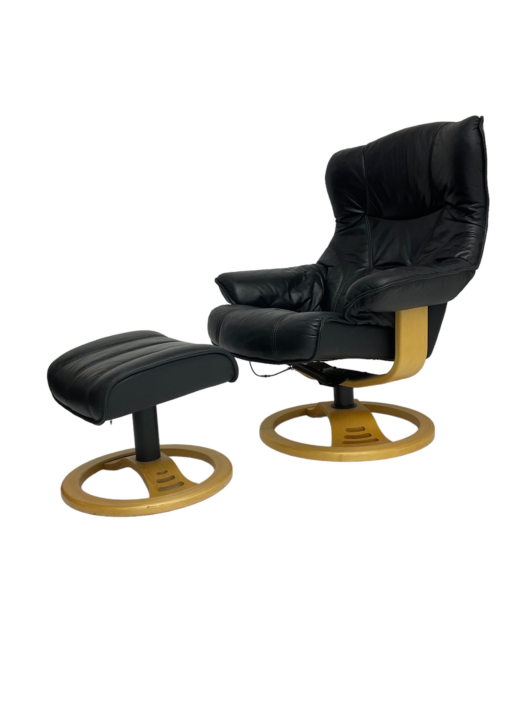 Anderssons of Sweden - mid-20th century design swivel armchair, upholstered black leather, raised on beech U-frame supports with circular base, together with matching footstool 