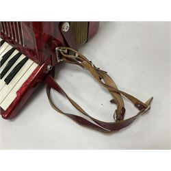 German Hohner student II compact accordion with 26 keys and 12 bass registers in a hard case With tutor