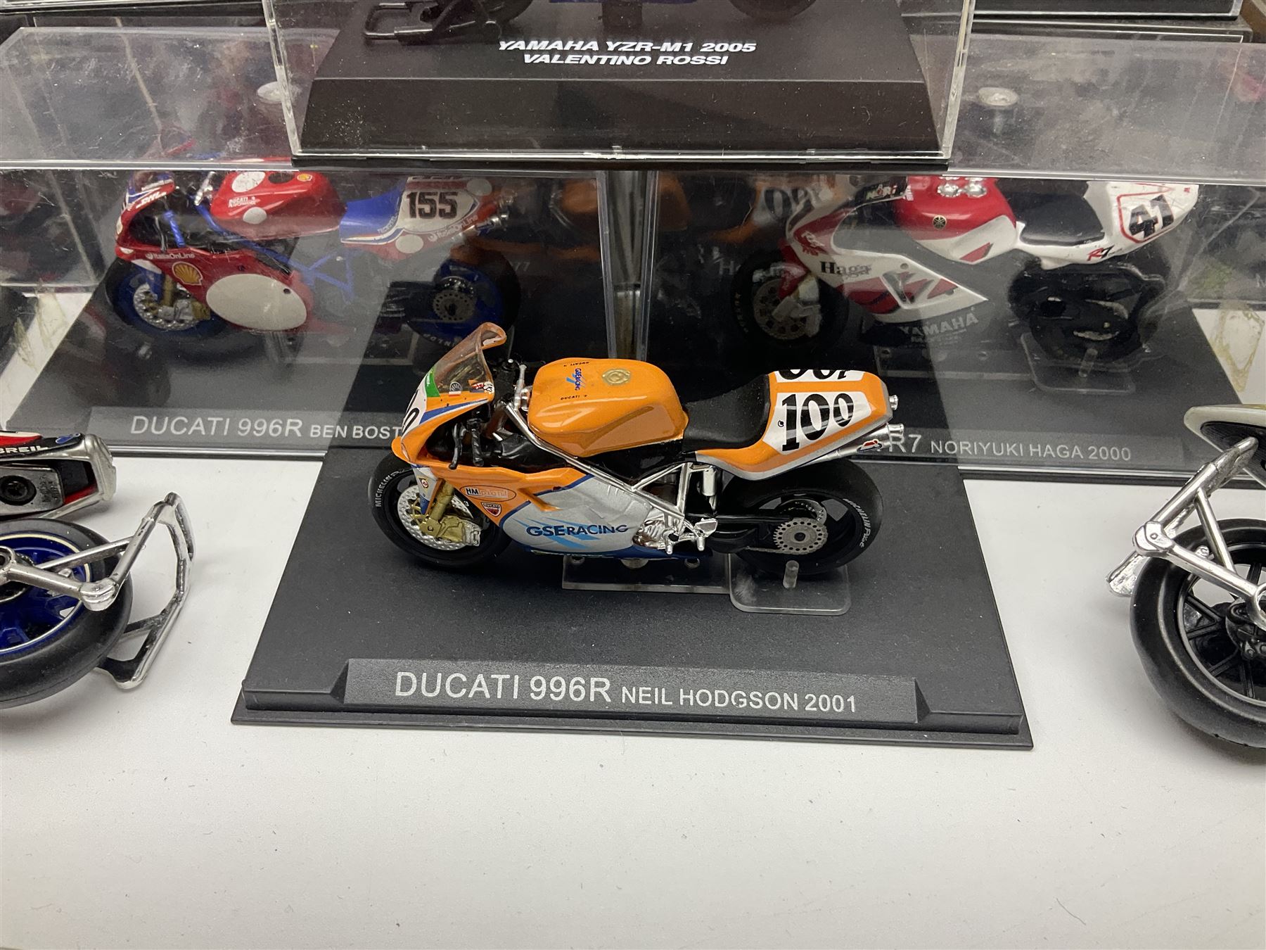 Fifty-one die-cast models of motorcycles by Maisto, Protar Italeri, Welly etc; many in perspex display boxes, some in window boxes and some unboxed