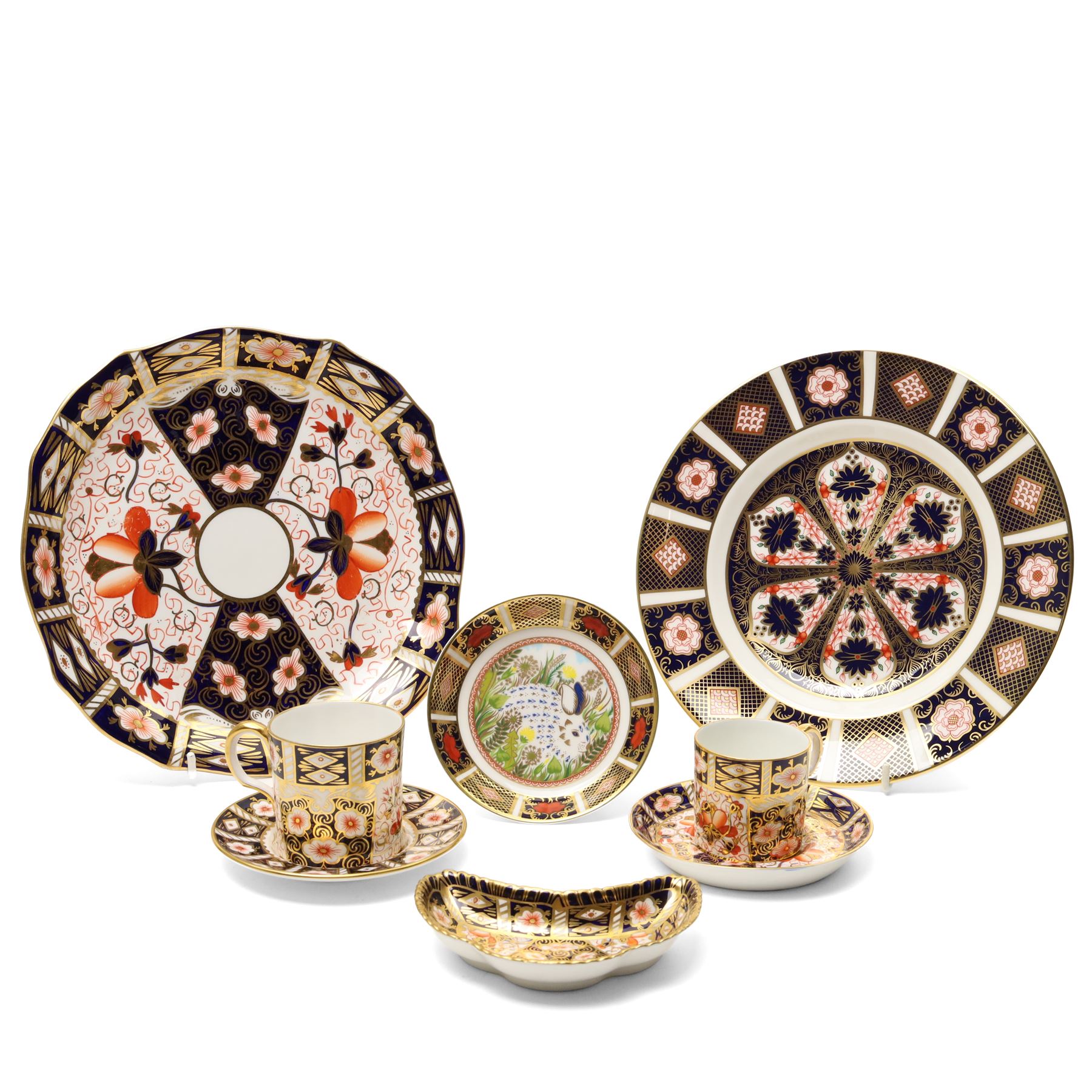 Royal Crown Derby pattern 2451 items, comprising smaller and larger coffee cans with saucers, crescent pin tray and plate (D23cm), together with a boxed Yorkshire Rose pattern plate, and a 1999 'Rabbit' year tray