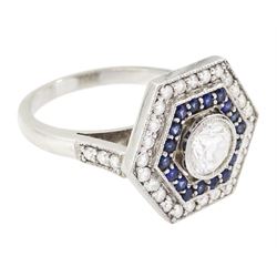 Platinum diamond and sapphire hexagonal ring, the principle diamond of approx 0.55 carat, with sapphire and round brilliant cut diamond surround, all milgrain set, hallmarked