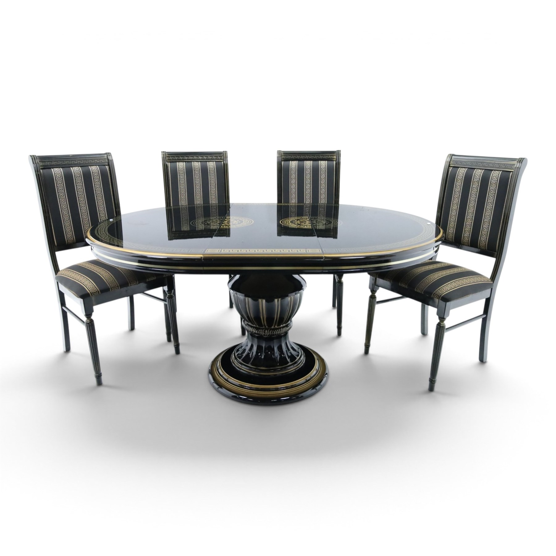 Italian Neoclassical inspired ebonised gloss dining table with four matching chairs,  circular top with additional leaf (Extends to  145cm) with Greek key banding, on a shaped pedestal base with gilt highlights and stepped plinth, the chairs en suite with padded back and seat with Greek key, reeded front supports