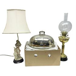 Silver plated meat dome, brass oil lamp, figural table lamp and a box of linen, tallest H75cm