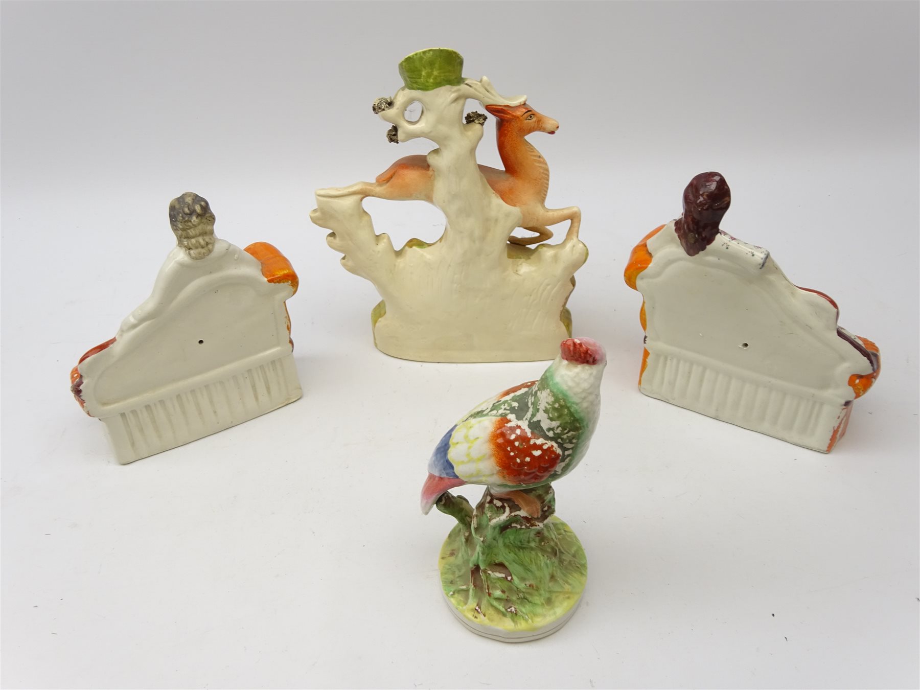 Staffordshire flatback figures of male and female musicians, lying on couches and reading music Staffordshire flatback figures of male and female musicians, lying on couches and reading music