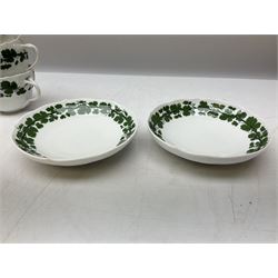 Meissen part tea service, with vine leaf decoration on a white ground, comprising thirteen teacups in two styles, five saucers and five dessert plates, (23)