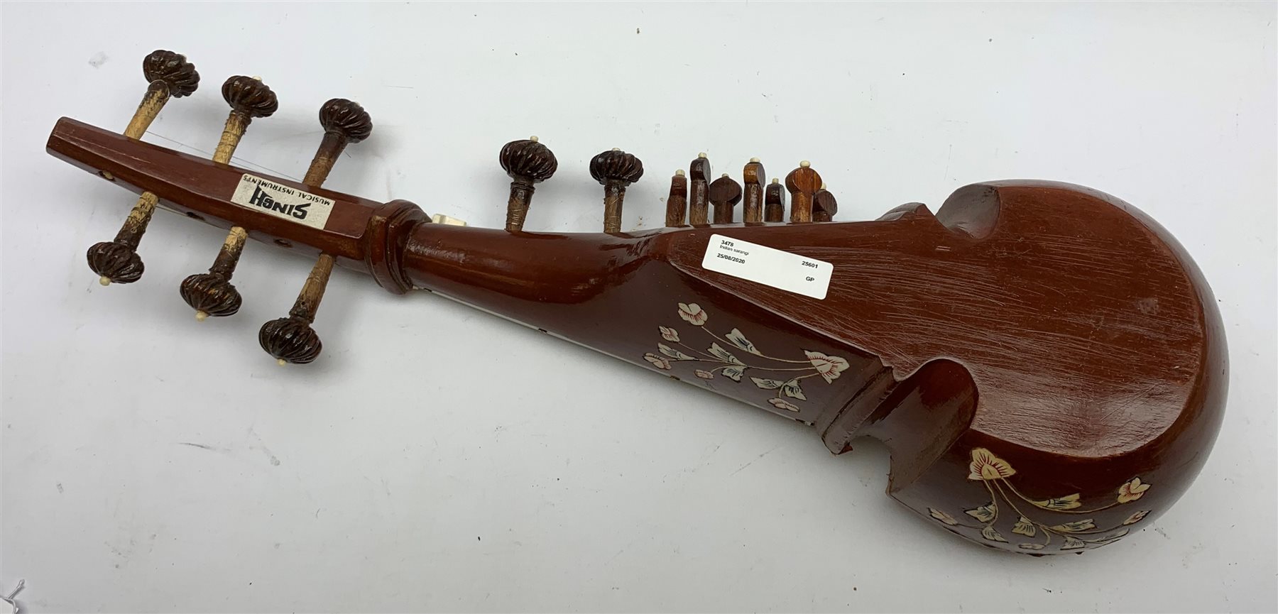 Indian sarangi multi-stringed instrument, the hardwood base with decorative bone inlay and mounts and metal covered fingerboard, L59cm