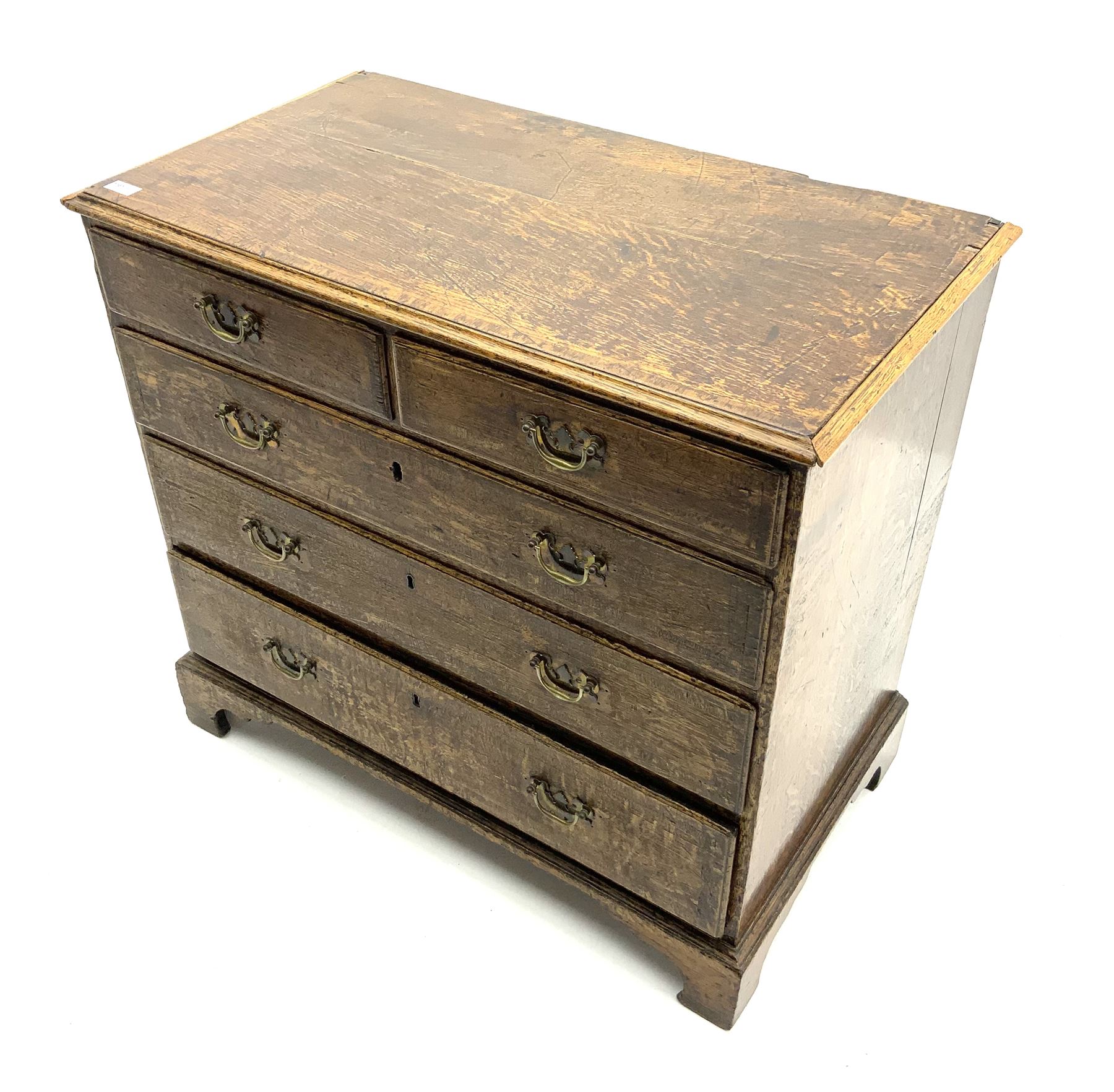 George III oak chest fitted with two short and three long drawers, corassbanded top
