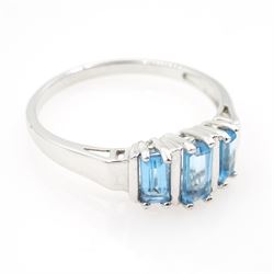 9ct white gold emerald cut three stone blue topaz ring, hallmarked